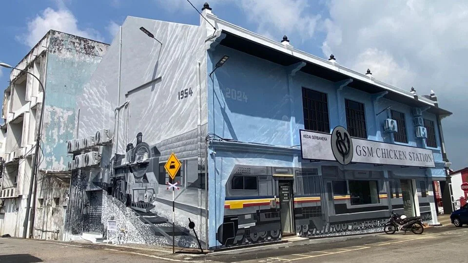 The “Train Across Time” mural depicts a 1954 steam train meeting a 2024 modern train